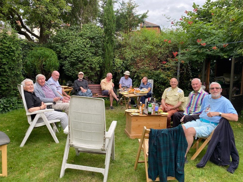 SLG members relaxing together in a garden